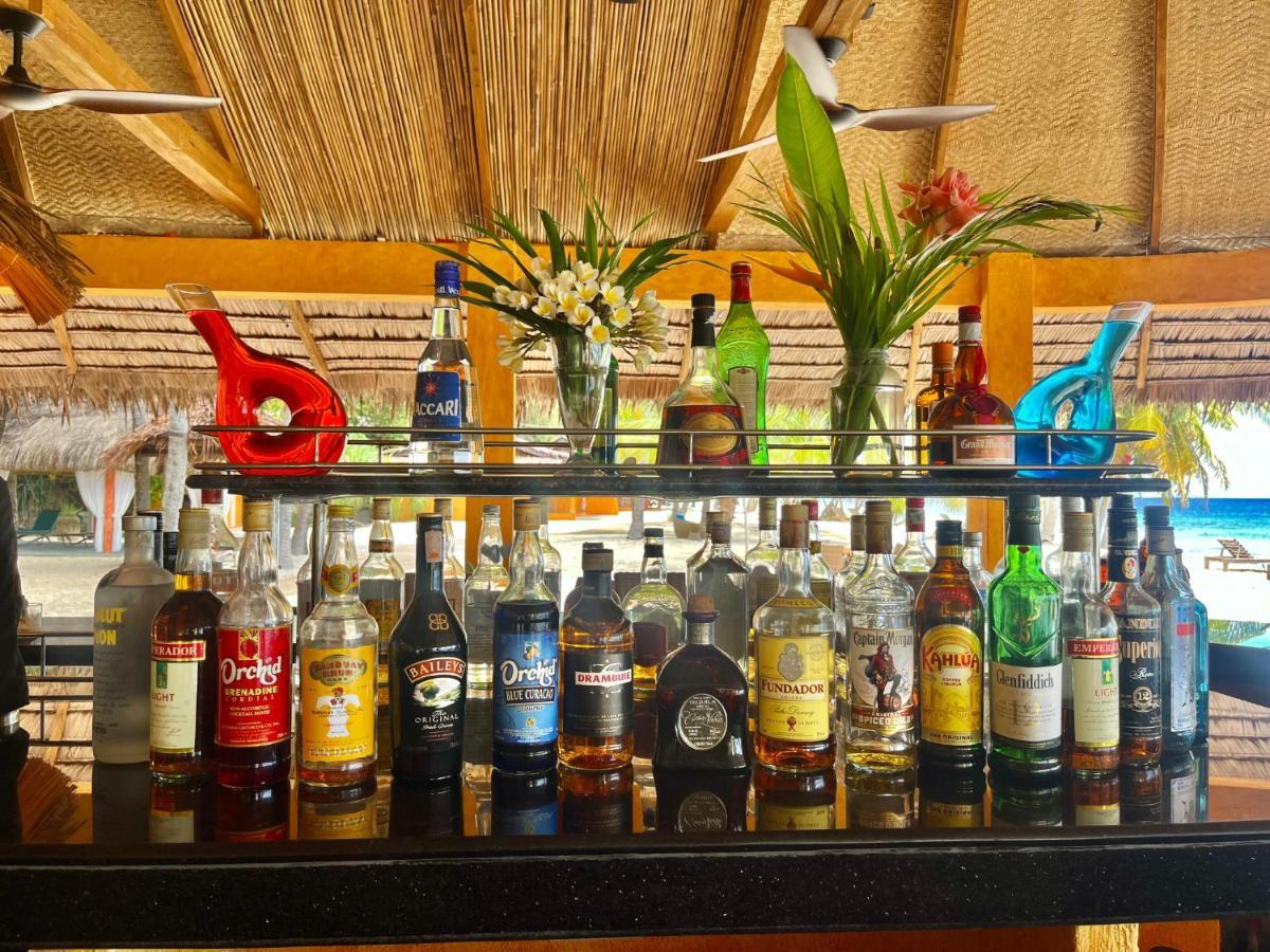 Coco Grove Beach Resort, Siquijor Island Εξωτερικό φωτογραφία Rum bottles at a bar in the Caribbean